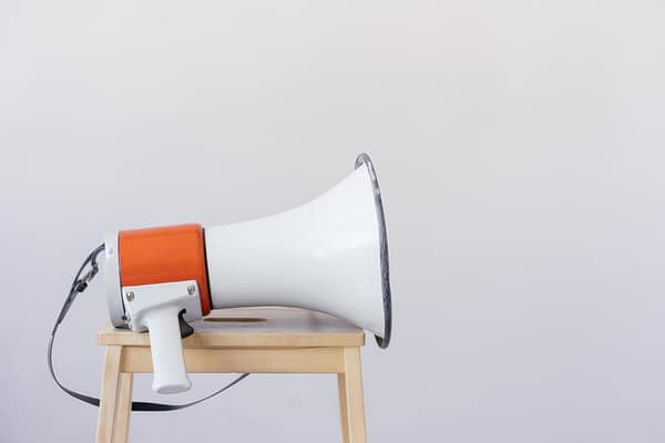 loudspeaker on top of wooden chair